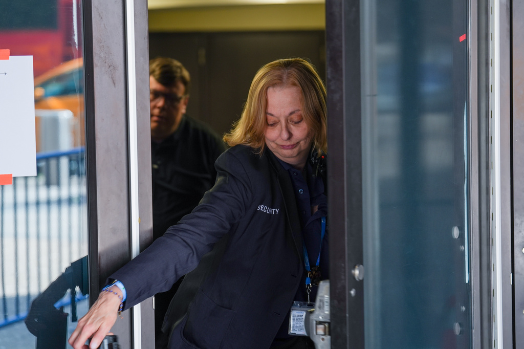 A security guard closes a door to Madison Square Garden after noticing members of the media outside, ahead of a reported wedding between singer Taylor Swift and National Football League player Travis Kelce on Thursday, July 2, 2026, in New York. (AP Photo/Ryan Murphy)
