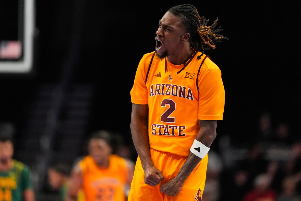 Arizona State guard Anthony Johnson celebrates after making a basket during the first half of an NCAA college basketball game against Baylor at the Big 12 Conference tournament Tuesday, March 10, 2026, in Kansas City, Mo. (AP Photo/Charlie Riedel)