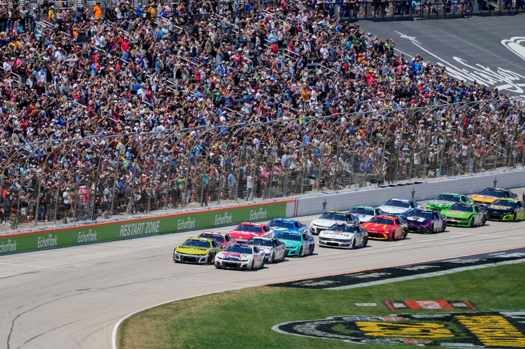 FILE - Carson Hocevar and William Byron lead the pack to start a NASCAR Cup Series auto race at Texas Motor Speedway in Fort Worth, Texas, May 4, 2025. (AP Photo/Gareth Patterson, File)