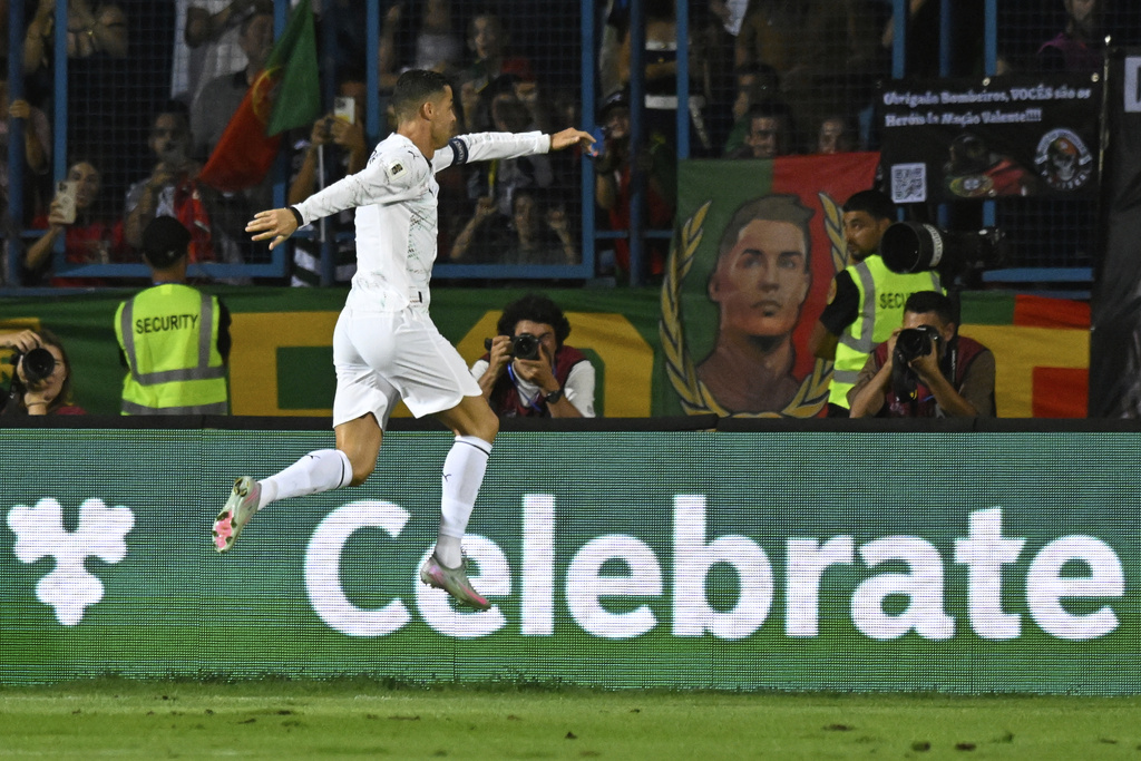 Portugal's Cristiano Ronaldo celebrates after scoring his side's second goal during a World Cup 2026 group F qualifying soccer match between Armenia and Portugal at the Vazgen Sargsyan stadium in Yerevan, Armenia, Saturday, Sept. 6, 2025. (AP Photo/Hakob Berberyan)