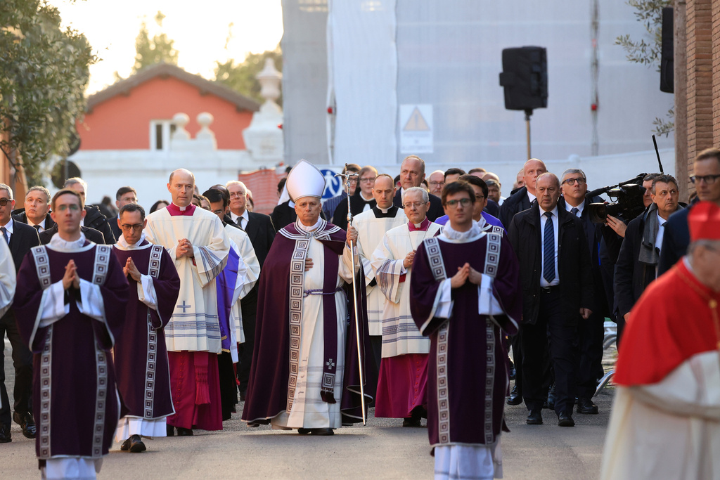 Pope Leo XIV, center, arrives, with bishops and cardinals in a penitential procession marking the start of the Catholic Lent, at the Basilica of Santa Sabina in Rome, Wednesday, Feb. 18, 2026, where he will preside over Ash Wednesday Mass. (AP Photo/Riccardo De Luca)
