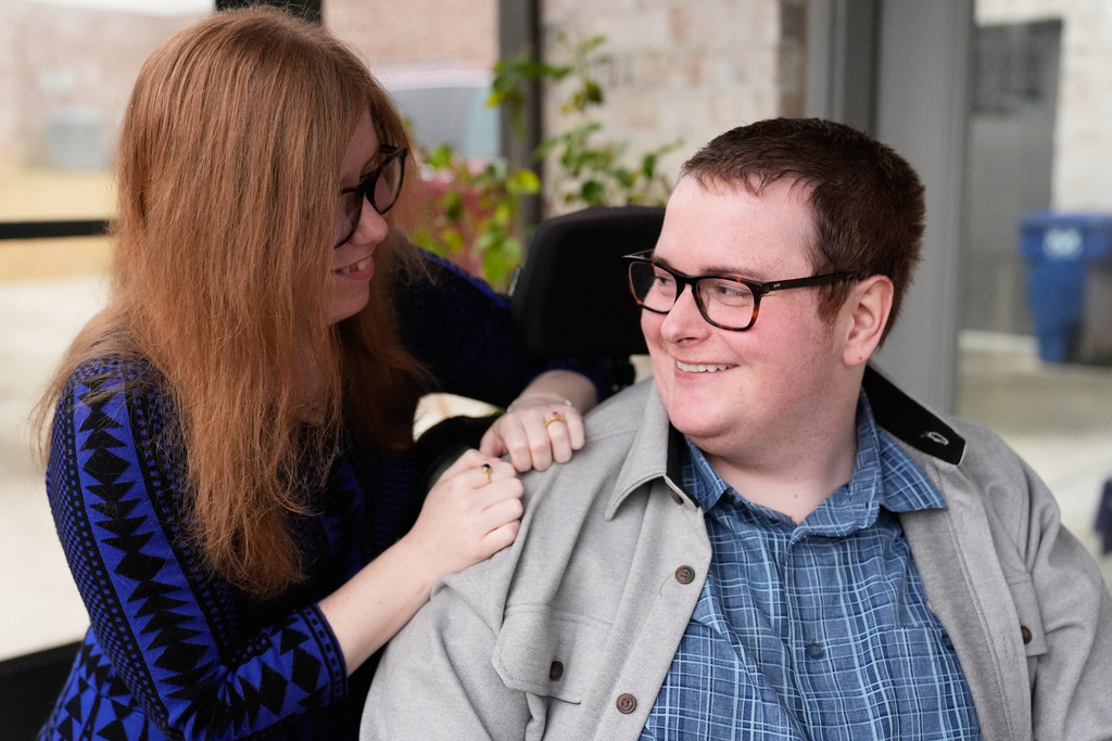 Kaci LaFon, left, appears with her husband Collin LaFon at their home in Trussville, Ala., on on Friday, Nov. 21, 2025. (AP Photo/Brynn Anderson)