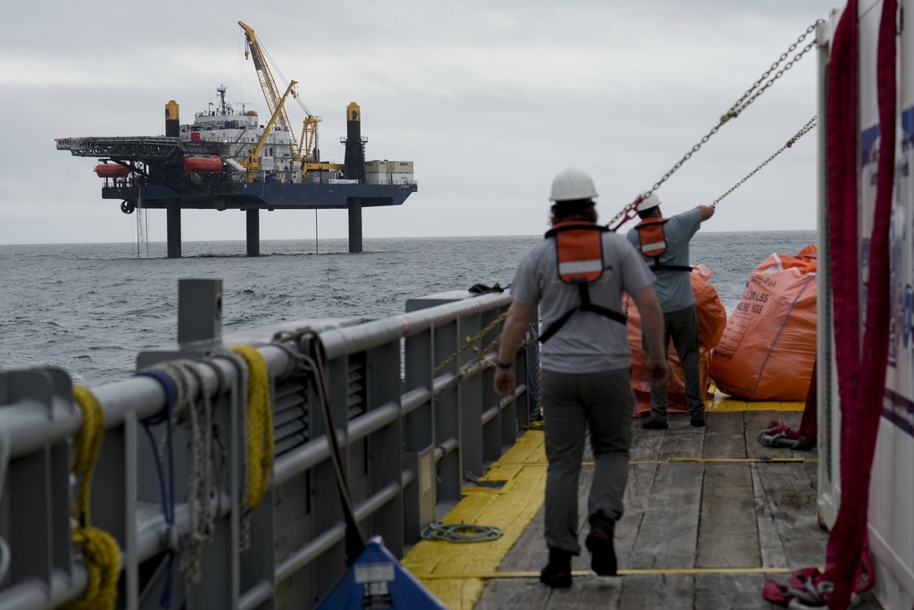 The Liftboat Robert platform is visible from the departing Gaspee, a crew transport vessel, in the North Atlantic, as it begins the eight-hour trip back to Fall River, Mass., Sunday, July 20, 2025. (AP Photo/Carolyn Kaster)