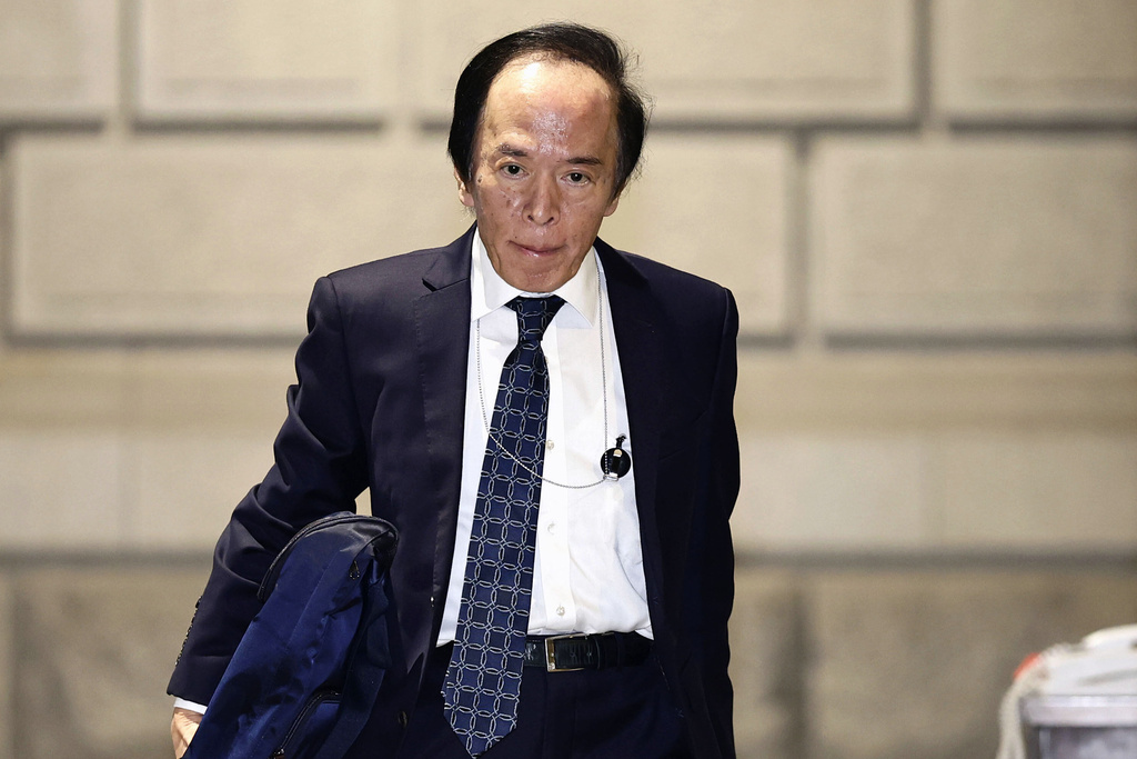 The Bank of Japan (BOJ) Gov. Kazuo Ueda arrives at the headquarters of BOJ in Tokyo, Friday, Dec. 19, 2025. (Kyodo News via AP)
