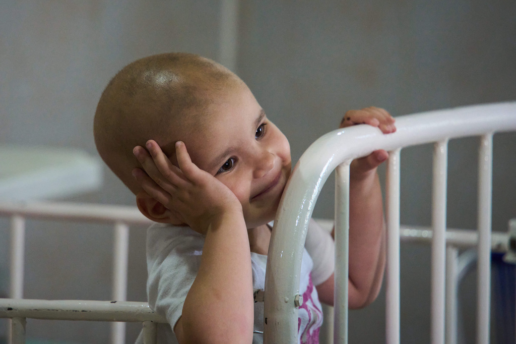 Nashly Zerquera, a 4-year-old oncology patient, sits in her bed at the National Institute of Oncology and Radiobiology in Havana, Cuba, Wednesday, June 24, 2026. (AP Photo/Ramon Espinosa)