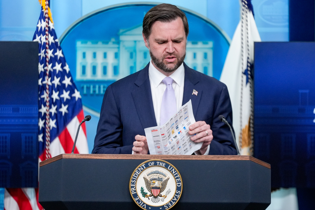 Vice President JD Vance arrives with a seating chart to use as he speaks to reporters during a during a press briefing at the White House, Tuesday, May 19, 2026, in Washington. (AP Photo/Manuel Balce Ceneta)