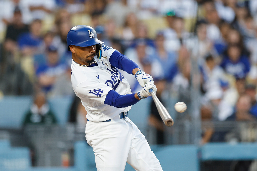Los Angeles Dodgers' Mookie Betts (50) hits a solo home run during the second inning of a baseball game against the Kansas City Royals, Tuesday, Aug. 11, 2026, in Los Angeles. (AP Photo/Caroline Brehman)