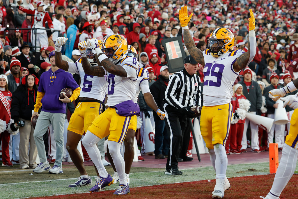LSU wide receiver Zavion Thomas, center, and his teammates celebrate his touchdown against Oklahoma during the third quarter of an NCAA college football game Saturday, Nov. 29, 2025, in Norman, Okla. (AP Photo/Alonzo Adams)