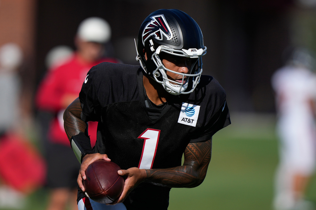 Atlanta Falcons quarterback Tua Tagovailoa (1) runs drills during an NFL football training camp practice on Monday, Aug. 17, 2026, in Flowery Branch, Ga. (AP Photo/Brynn Anderson)
