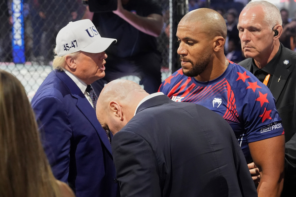 President Donald Trump, left, congratulates Ciryl Gane following his win in a heavyweight interim title bout against Alex Pereira at UFC Freedom 250 on the South Lawn of the White House, Monday, June 15, 2026, in Washington. (AP Photo/Mark Schiefelbein)