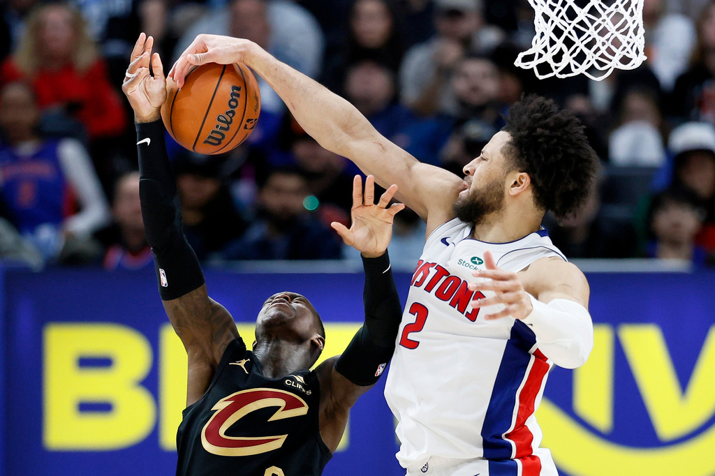Detroit Pistons guard Cade Cunningham (2) blocks a shot attempted by Cleveland Cavaliers guard Dennis Schroder (8) during the second half in Game 2 of a second-round NBA playoffs basketball series, Thursday, May 7, 2026, in Detroit. (AP Photo/Duane Burleson)