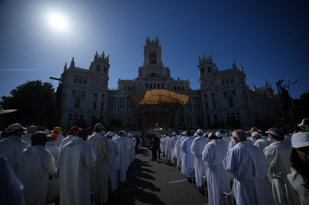Clergymen wait for Pope Leo XIV to arrive to preside over Mass marking the feast of Corpus Christi in Plaza de Cibeles in Madrid, Sunday, June 7, 2026, on the second day of his seven-day apostolic journey to mainland Spain and the Canary Islands. (AP Photo/Alessandra Tarantino)