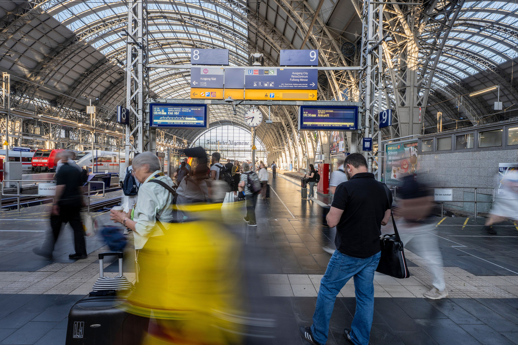 Travelers are on the move at the main train station in Frankfurt, Germany early Wednesday, June 24, 2026. (Andreas Arnold/dpa via AP)