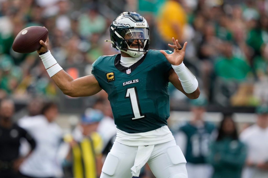 Philadelphia Eagles quarterback Jalen Hurts (1) throws against the Washington Commanders during the first half of an NFL football game, Sunday, Sept. 13, 2026, in Philadelphia. (AP Photo/Matt Slocum)