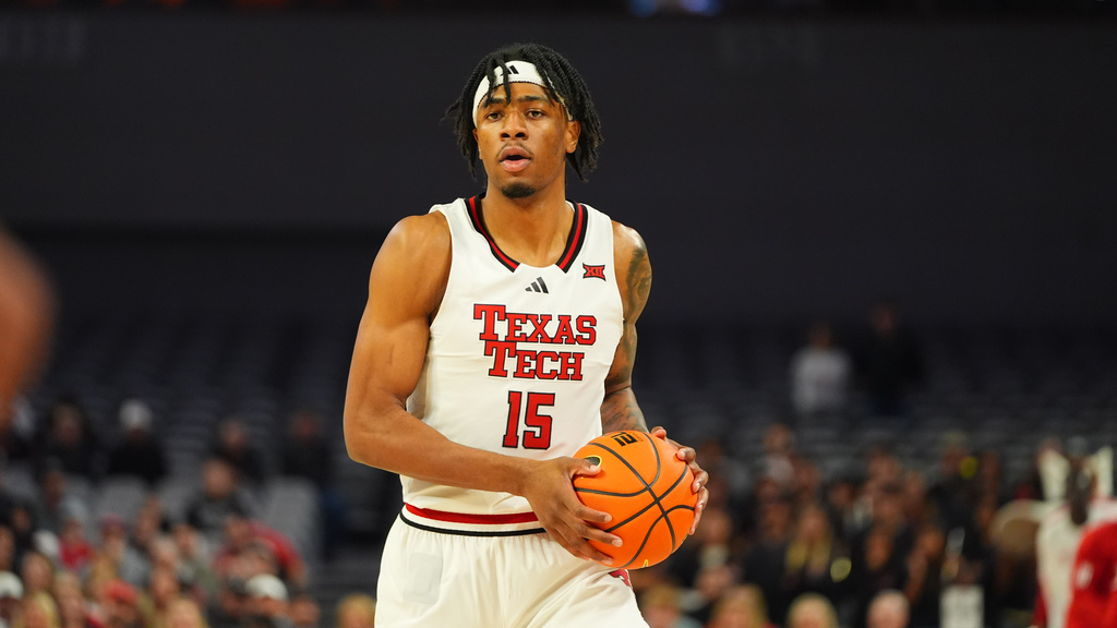 Texas Tech forward JT Toppin looks to move the ball during the first half of an NCAA college basketball game against LSU, Sunday, Dec. 7, 2025, in Fort Worth, Texas. (AP Photo/LM Otero)