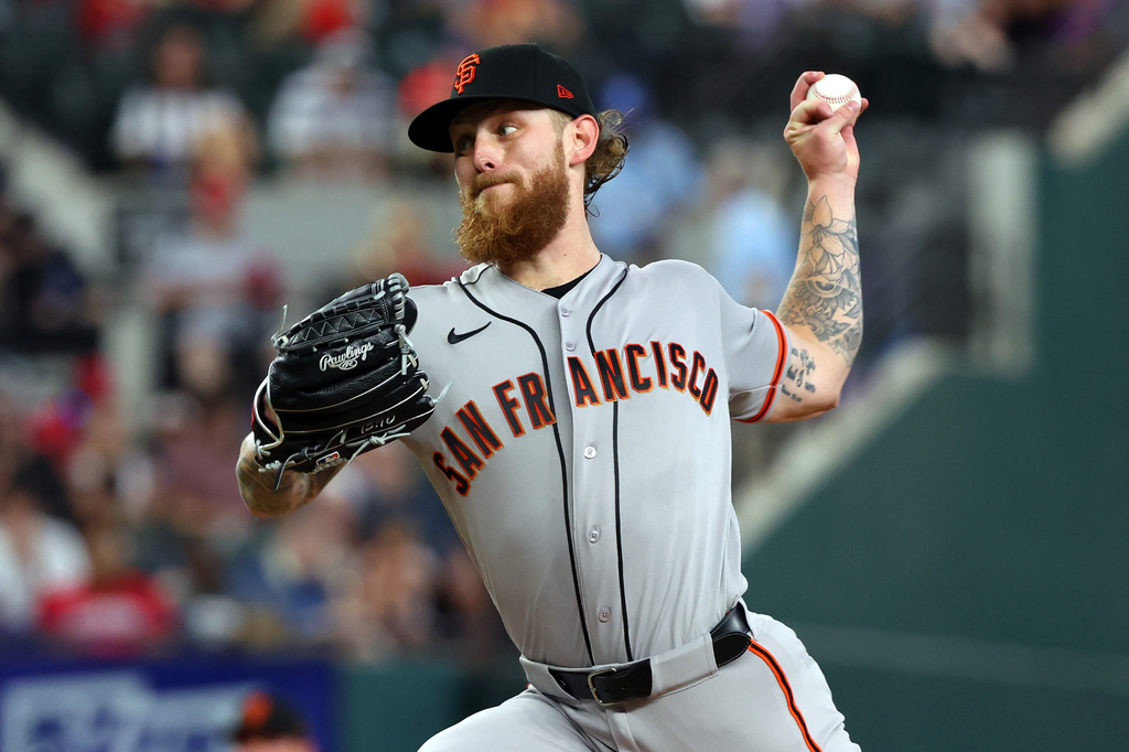 San Francisco Giants pitcher Carson Whisenhunt delivers a pitch against the Texas Rangers in the first inning of a baseball game in Arlington, Texas, Wednesday, Aug 5, 2026. (AP Photo/ Richard W. Rodriguez)