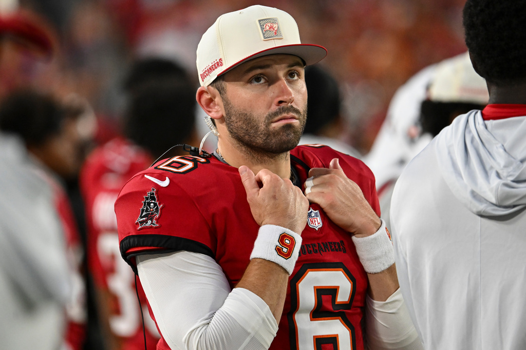 Tampa Bay Buccaneers quarterback Baker Mayfield (6) watches play against the Kansas City Chiefs in the first half an NFL football game, Saturday, Aug. 22, 2026, in Tampa, Fla. (AP Photo/Mark LoMoglio)