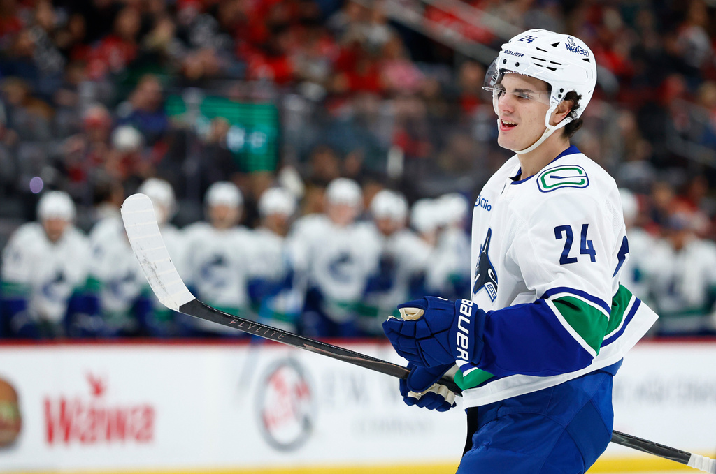 Vancouver Canucks defenseman Zeev Buium looks on after scoring during the first period of an NHL hockey game against the New Jersey Devils, Sunday, Dec 14, 2025, in Newark, N.J. (AP Photo/Noah K. Murray)