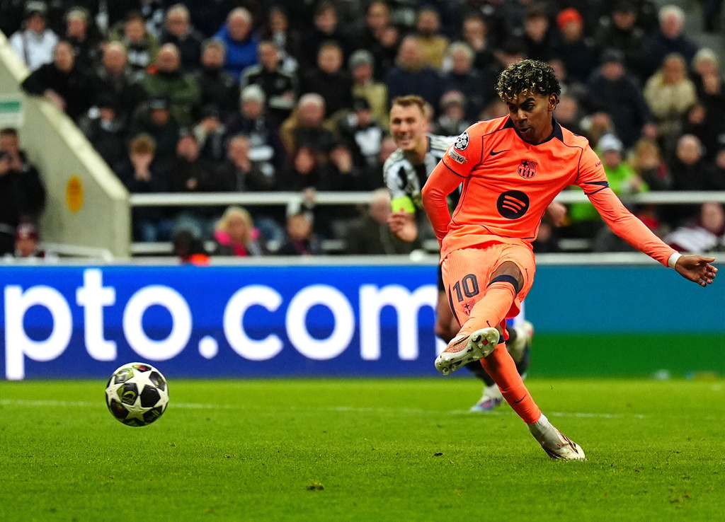 Barcelona's Lamine Yamal scores during the Champions League round of 16 first leg soccer match between Newcastle United and Barcelona in Newcastle, England, Tuesday, March 10, 2026. (Owen Humphreys/PA via AP)