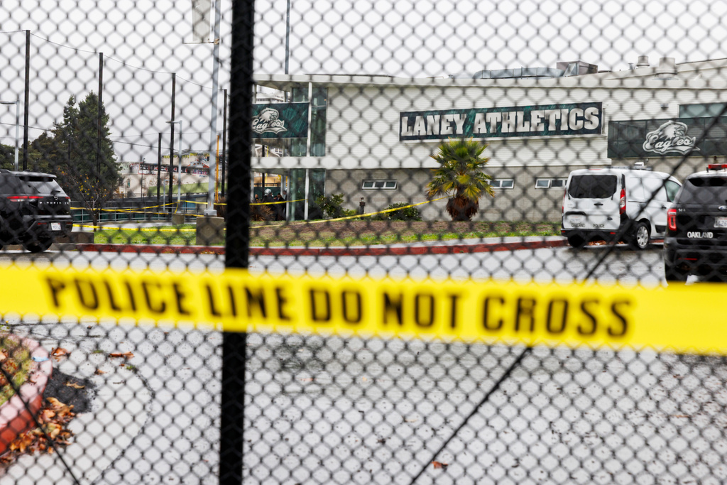 Crime scene tapes ropes off an area after a shooting at Laney College in Oakland, Calif., on Thursday, Nov. 13, 2025. (Santiago Mejia/San Francisco Chronicle via AP)