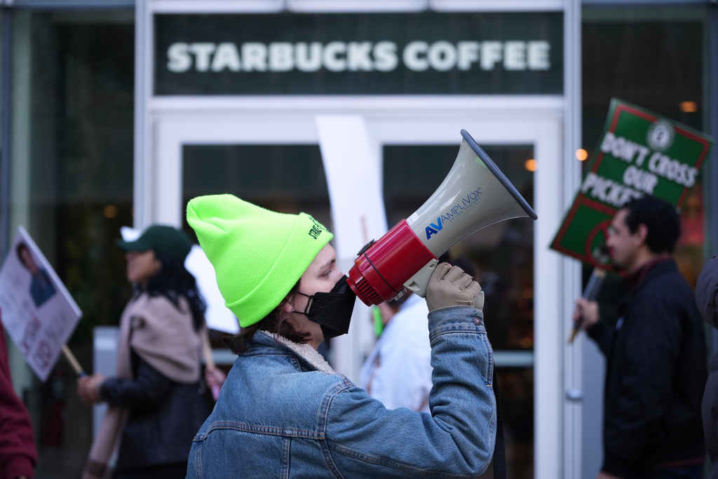 Protesters picket outside a Starbucks, Thursday, Nov. 13, 2025, in Philadelphia. (AP Photo/Matt Slocum)