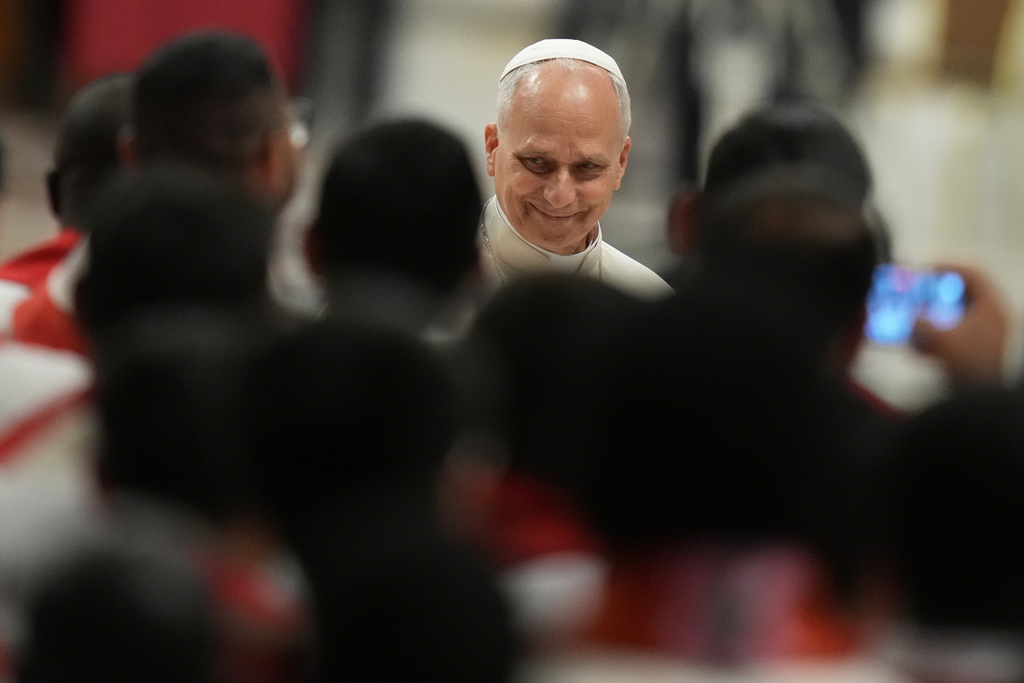 Pope Leo XIV, smiles after signing the apostolic letter on education before celebrating a Mass for the opening of the academic year of the Pontifical University and for the Jubilee of the Educational World in St. Peter's Basilica at the Vatican, Monday, Oct. 27, 2025.(AP Photo/Alessandra Tarantino)
