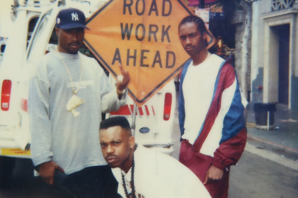 This undated photo provided by Maurice "Mopreme" Shakur on Wednesday, July 22, 2026, shows, from left, Tupac Shakur, Mike Cooley, and Mopreme Shakur, posing for a photo in Los Angeles. (Mopreme Shakur via AP)