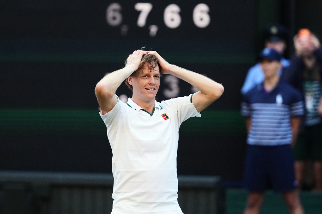 Jannik Sinner of Italy reacts after winning against Alexander Zverev of Germany in the men's singles final at Wimbledon Tennis Championships in London, Sunday, July 12, 2026. (AP Photo/Kirsty Wigglesworth)