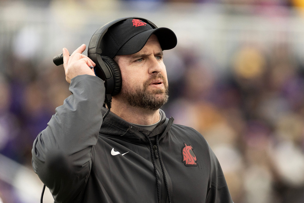FILE - Washington State head coach Jimmy Rogers reacts to a play during the first half of an NCAA college football game against James Madison, Nov. 22, 2025, in Harrisonburg, Va. (AP Photo/Ryan M. Kelly, File)