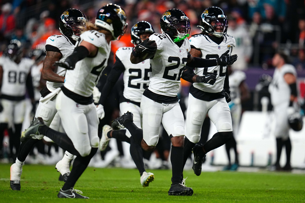 Jacksonville Jaguars cornerback Jarrian Jones (22) celebrates after intercepting a pass against the Denver Broncos during the second half of an NFL football game in Denver, Sunday, Dec. 21, 2025. (AP Photo/Jack Dempsey)
