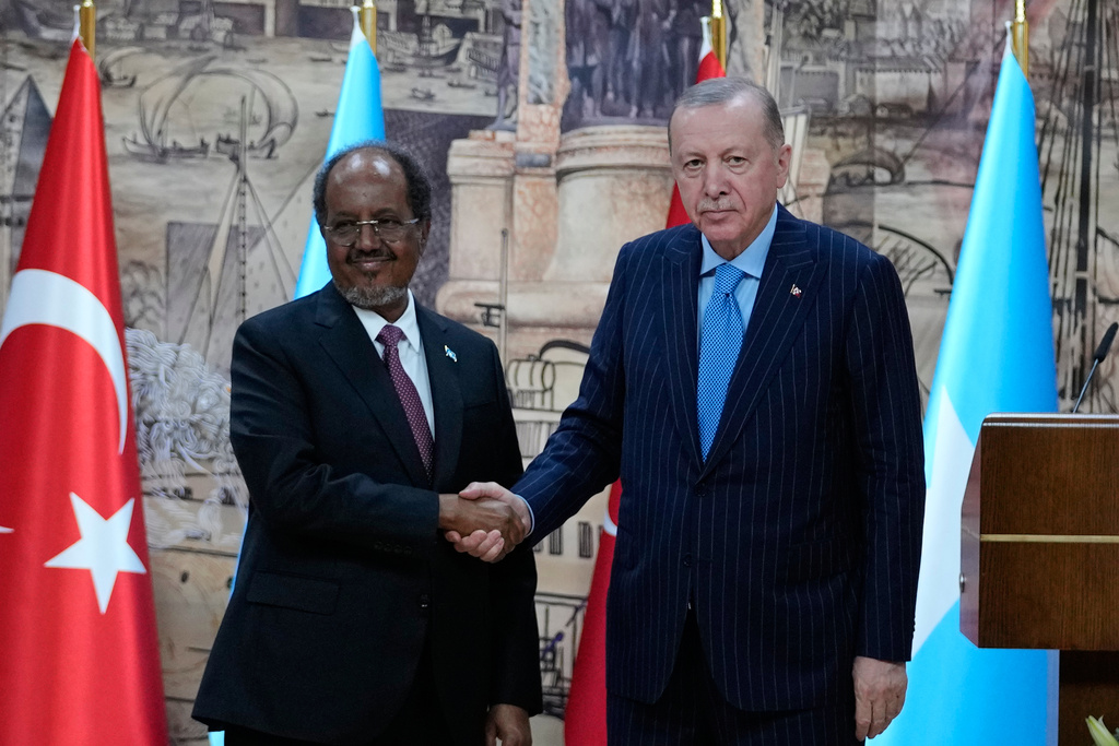 Somalia's President Hassan Sheikh Mohamud, left, shakes hands with Turkey's President Recep Tayyip Erdogan following a news conference in Istanbul, Turkey, Tuesday, Dec. 30, 2025. (AP Photo/Khalil Hamra)