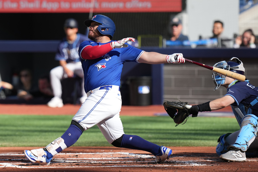 Toronto Blue Jays' Alejandro Kirk hits a grand slam against the Tampa Bay Rays during first-inning baseball game action in Toronto, Sunday, Sept. 28, 2025. (Chris Young/The Canadian Press via AP)