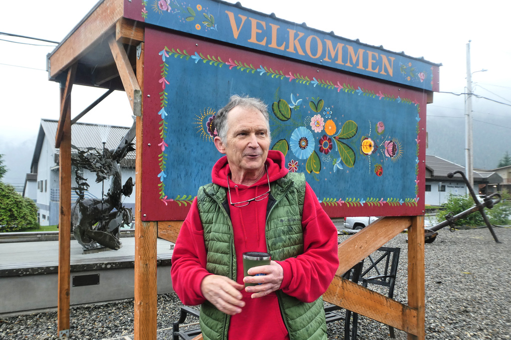 FILE - Dan Sullivan, a candidate in Alaska's U.S. Senate race who shares a name with the incumbent seeking reelection, talks in front of a welcome sign near downtown Petersburg, Alaska, July 3, 2026. (AP Photo/Becky Bohrer, File)