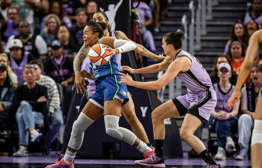 Napheesa Collier (24) is defended by Gabby Williams (1) in the second half as the Golden State Valkyries played the Minnesota Lynx at Chase Center in San Francisco on Wednesday, Aug. 19, 2026. (Carlos Avila Gonzalez/San Francisco Chronicle via AP)