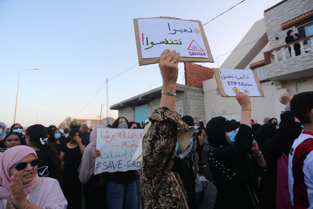 People take part in a demonstration against pollution caused by chemical factories, in Gabes, Tunisia, Wednesday, Oct. 16, 2025. Banner in Arabic reads "We would like to breathe." (AP Photo/Bassem Aouini)