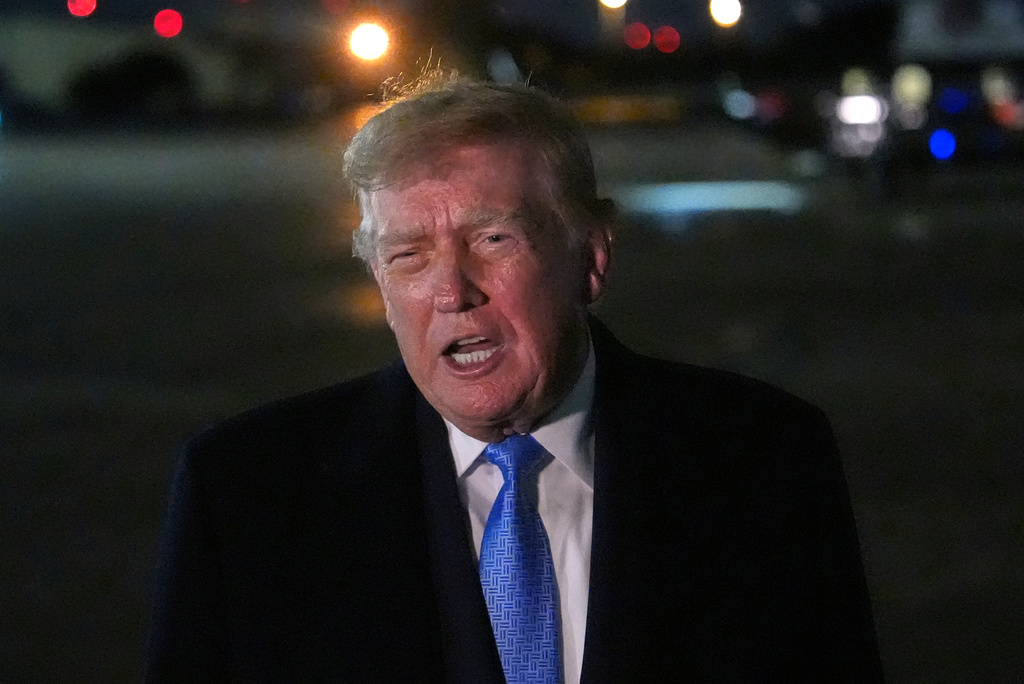 President Donald Trump speaks with reporters upon arriving, Sunday, Sept. 27, 2026, at Joint Base Andrews, Md. (AP Photo/Julia Demaree Nikhinson)
