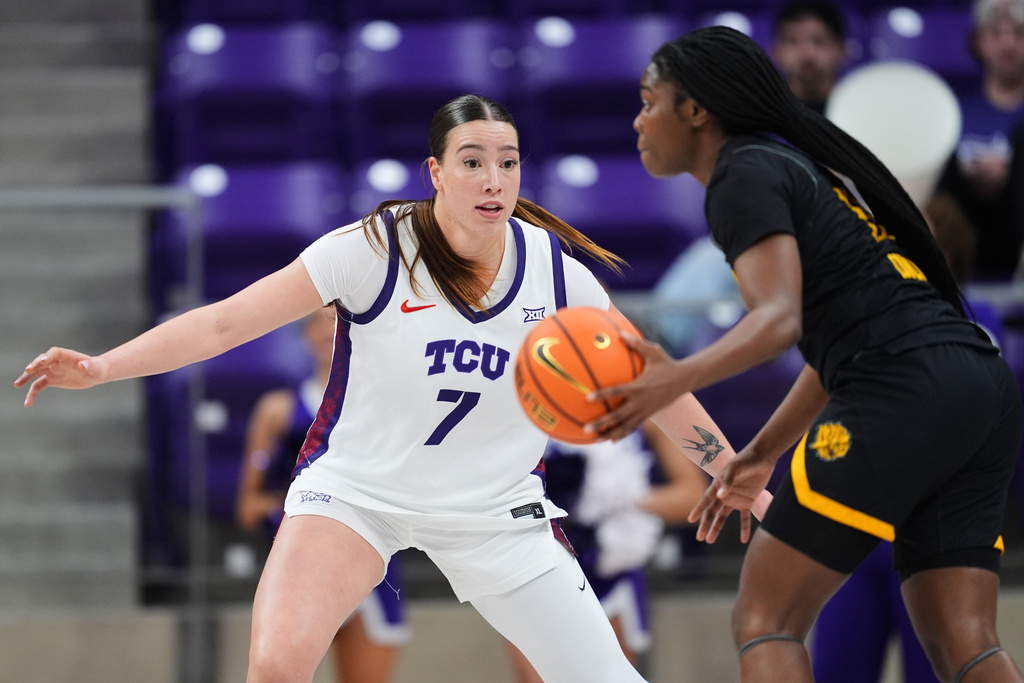 TCU forward Marta Suarez (7) defends against Arkansas Pine Bluff guard Jayla Cornelius (13) during an NCAA college basketball game in Fort Worth, Texas, Tuesday, Dec. 16, 2025. (AP Photo/Tony Gutierrez)