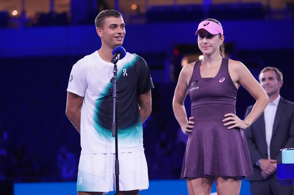 Belinda Bencic, of Switzerland, right, and Flavio Cobolli, of Italy, speak after they lost to Jakub Mensik, of the Czech Republic, and Karolina Muchova, of the Czech Republic, in mixed doubles final match at the U.S. Open tennis championships Thursday, Aug. 27, 2026, in New York. (AP Photo/Frank Franklin II)