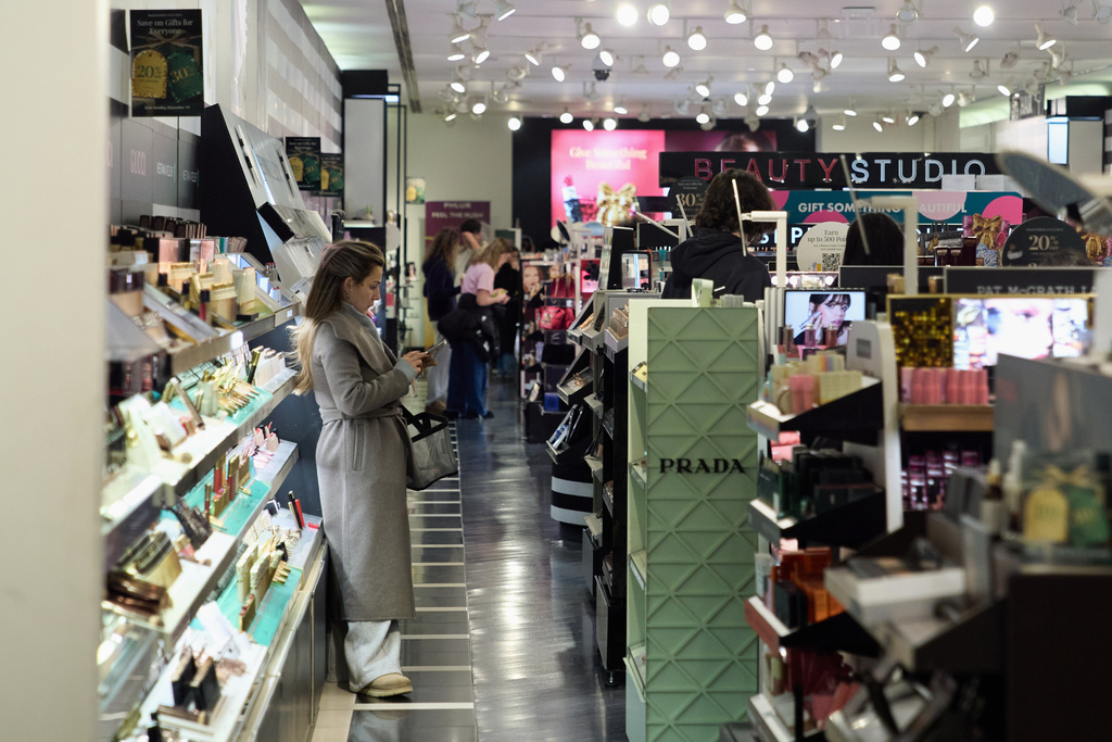 People shop at the Somerset Collection mall, Wednesday, Dec. 10, 2025, in Troy, Mich. (AP Photo/Ryan Sun)