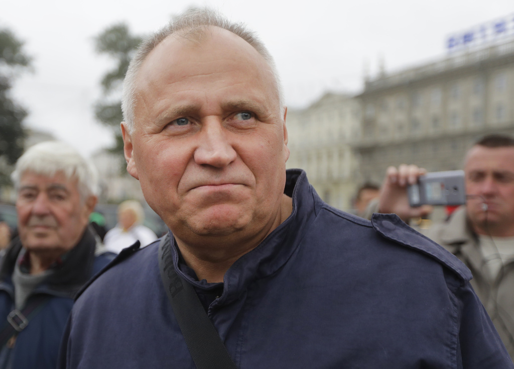 Veteran activist Mikalai Statkevich, who refused to cross into Lithuania, during the U.S.-negotiated release Thursday, is seen during protest action in Minsk, Belarus, Friday, Sept. 8, 2017. (AP Photo, File)