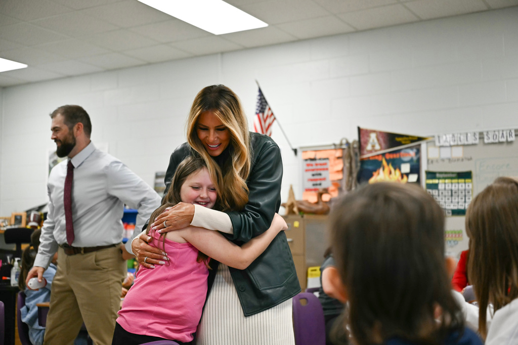 First Lady Melania Trump embraces a student at Mountain View Elementary School in Jefferson, N.C., Tuesday, Sept. 15, 2026. (Kent Nishimura/Pool Photo via AP)