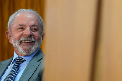 FILE - Brazil's President Luiz Inácio Lula da Silva smiles upon arriving at an event on the economy at the Planalto presidential palace in Brasilia, Brazil, July 14, 2025. (AP Photo/Eraldo Peres, File) FILE - Brazil's President Luiz Inácio Lula da Silva smiles upon arriving at an event on the economy at the Planalto presidential palace in Brasilia, Brazil, July 14, 2025. (AP Photo/Eraldo Peres, File)