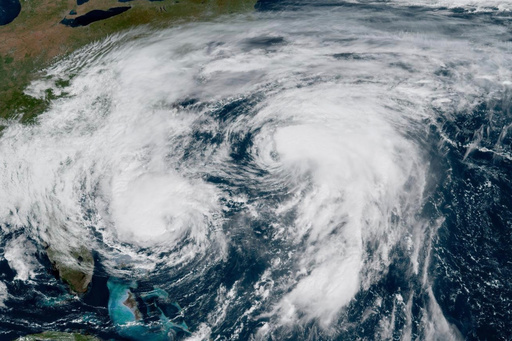This GOES-19 GeoColor satellite image taken Tuesday, Sept. 30, 2025 and provided by NOAA, shows weather systems in the Atlantic Ocean, Hurricane Imelda, left, and Hurricane Humberto at right. (NOAA via AP) This GOES-19 GeoColor satellite image taken Tuesday, Sept. 30, 2025 and provided by NOAA, shows weather systems in the Atlantic Ocean, Hurricane Imelda, left, and Hurricane Humberto at right. (NOAA via AP)
