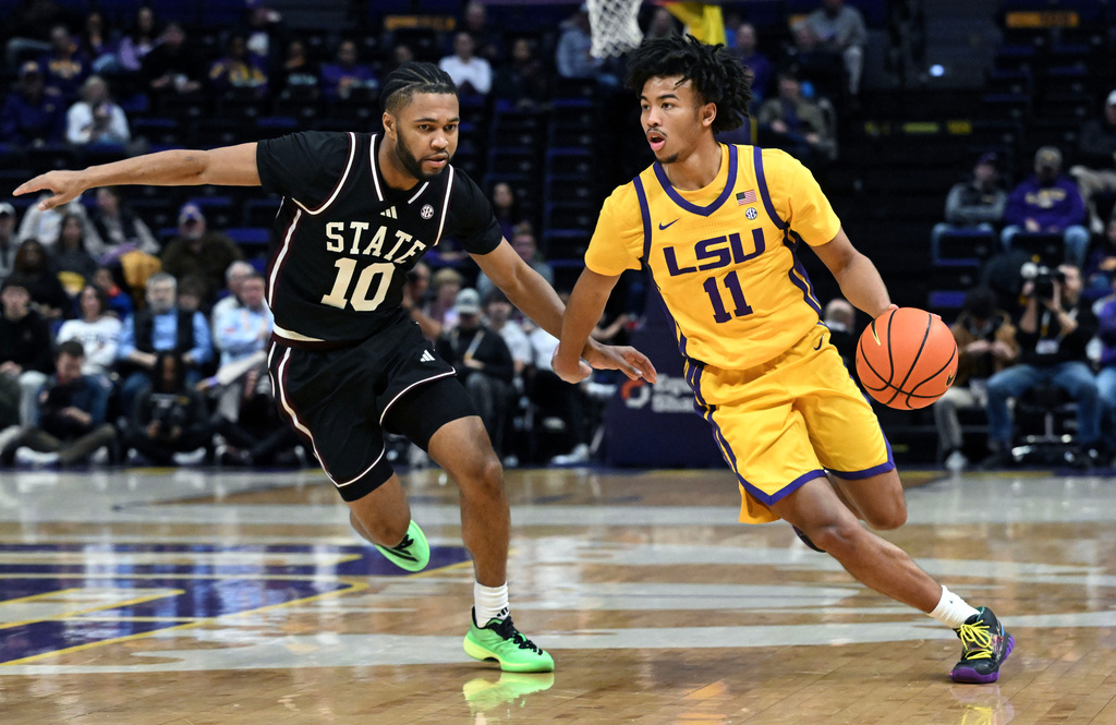 LSU guard Dedan Thomas Jr. (11) drives the ball around Mississippi State guard Jayden Epps (10), Wednesday, Jan 28, 2026, in Baton Rouge, La. (Hillary Scheinuk/The Advocate via AP)