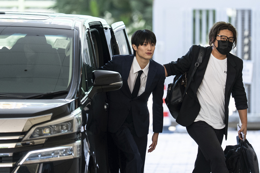 J-pop star Kenshin Kamimura arrives at the West Kowloon Magistrates' Courts to hear verdict over his indecent assault case in Hong Kong, Wednesday, August 13, 2025. (AP Photo/Chan Long Hei)