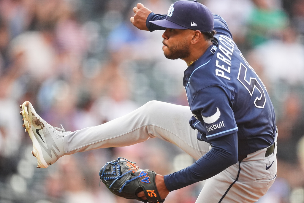Tampa Bay Rays starting pitcher Freddy Peralta works agianst the Colorado Rockies in the first inning of a baseball game Tuesday, Aug. 4, 2026, in Denver. (AP Photo/David Zalubowski)