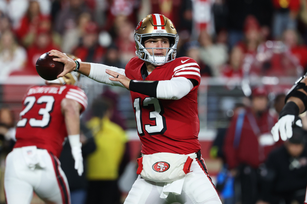 San Francisco 49ers quarterback Brock Purdy (13) passes against the Chicago Bears during the first half of an NFL football game in Santa Clara, Calif., Sunday, Dec. 28, 2025. (AP Photo/Jed Jacobsohn)