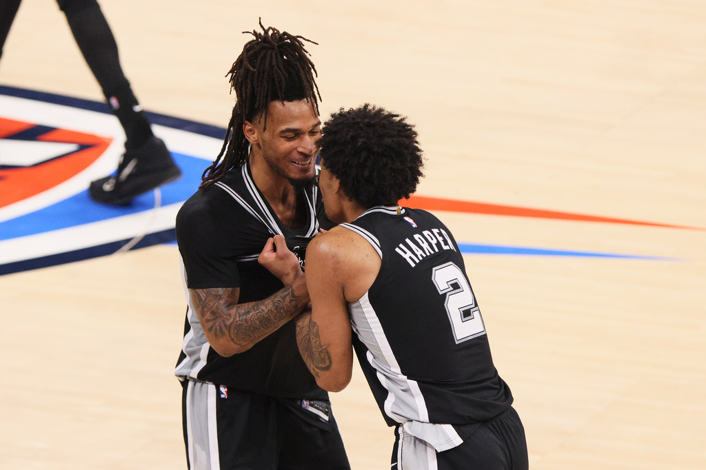 San Antonio Spurs guard Stephon Castle and guard Dylan Harper (2) celebrate in the second half of Game 7 of the Western Conference finals of the NBA basketball playoffs series against the Oklahoma City Thunder Saturday, May 30, 2026, in Oklahoma City. (AP Photo/Nate Billings)