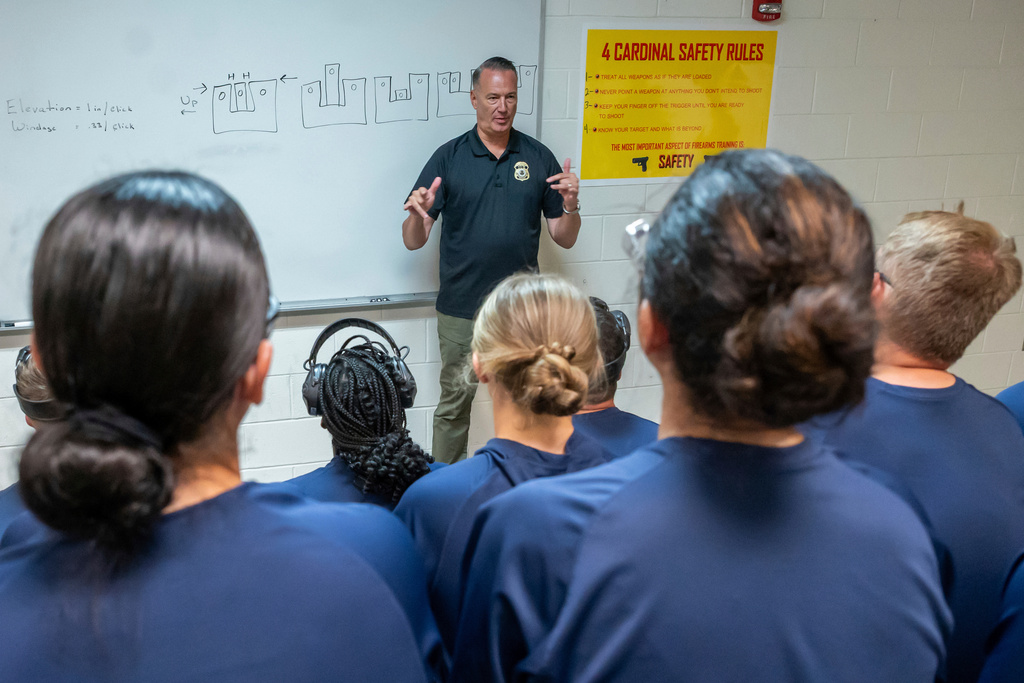 Todd Lyons, acting director of U.S. Immigration and Customs Enforcement (ICE) speaks to a group of trainees after they completed their time on the firing range at the Federal Law Enforcement Training Centers (FLETC) in Brunswick, Ga. on Thursday, Aug. 21, 2025. (AP Photo/Fran Ruchalski)