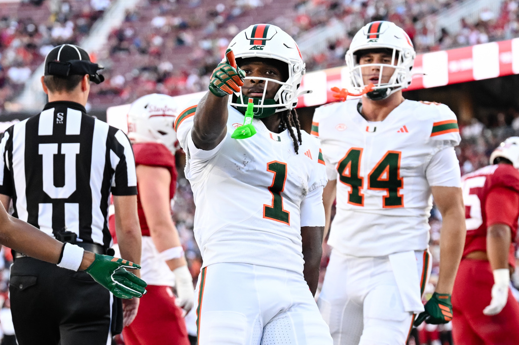 Miami wide receiver Malachi Toney (1) reacts after scoring a touchdown against Stanford during the first half of an NCAA college football game Friday, Sept. 4, 2026, in Stanford, Calif. (AP Photo/Thien-An Troung)